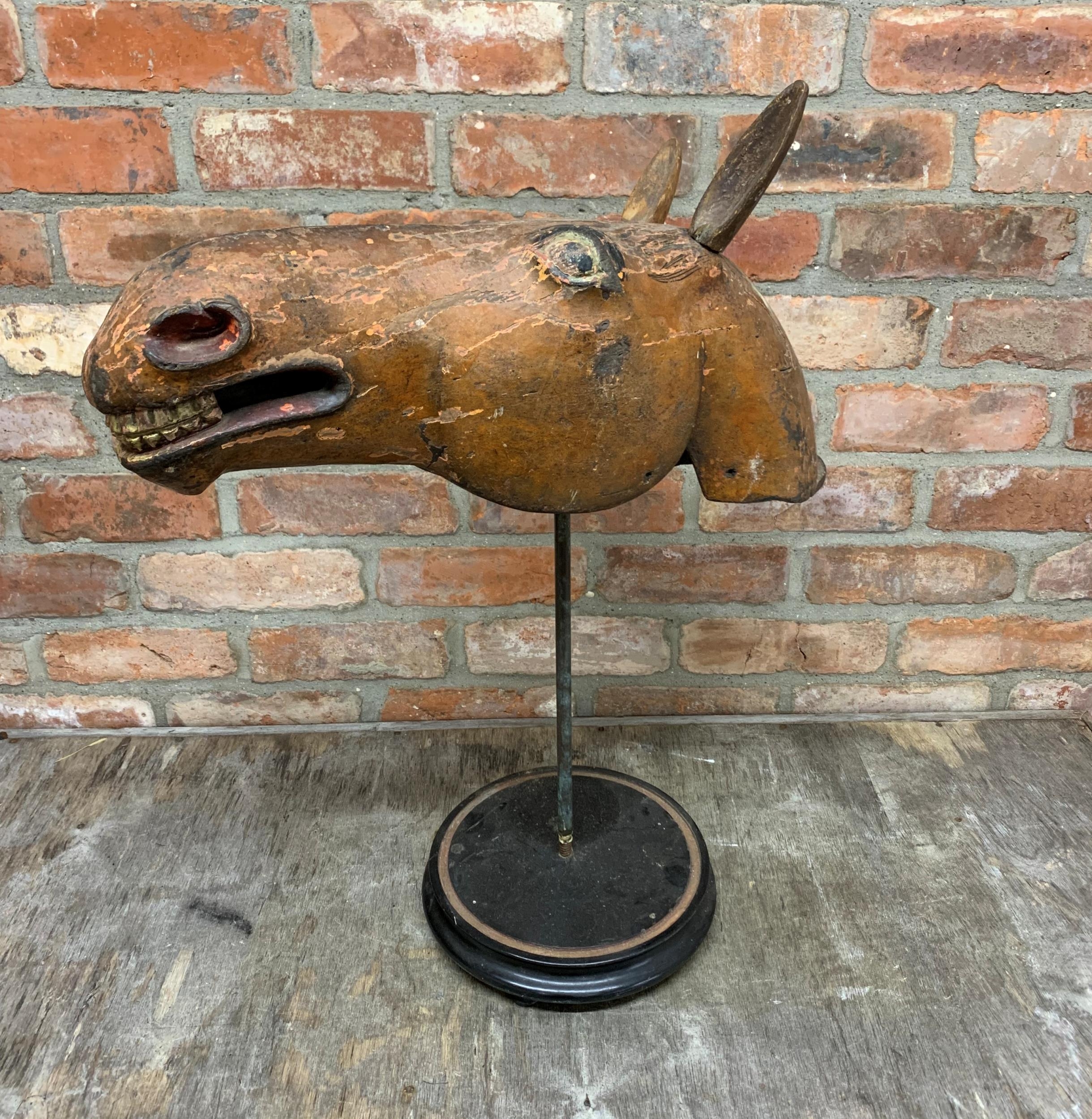 Wonderful antique Folk Art horse head with wooden ears on ebonised circular base, possibly a South