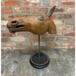 Wonderful antique Folk Art horse head with wooden ears on ebonised circular base, possibly a South