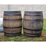 A pair of vintage wrought iron bound coopered oak barrels with glass tops, H 87cm x W 65cm approx (