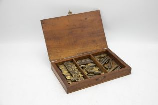 19th century mahogany box of brass bovine or agricultural animal tattoo letters and numbers, the box
