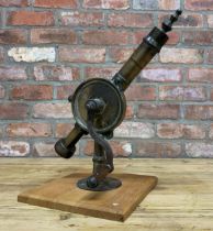 Antique brass 'eclipse' rotary handle wine bottle corkscrew mounted on wooden base, H 45cm