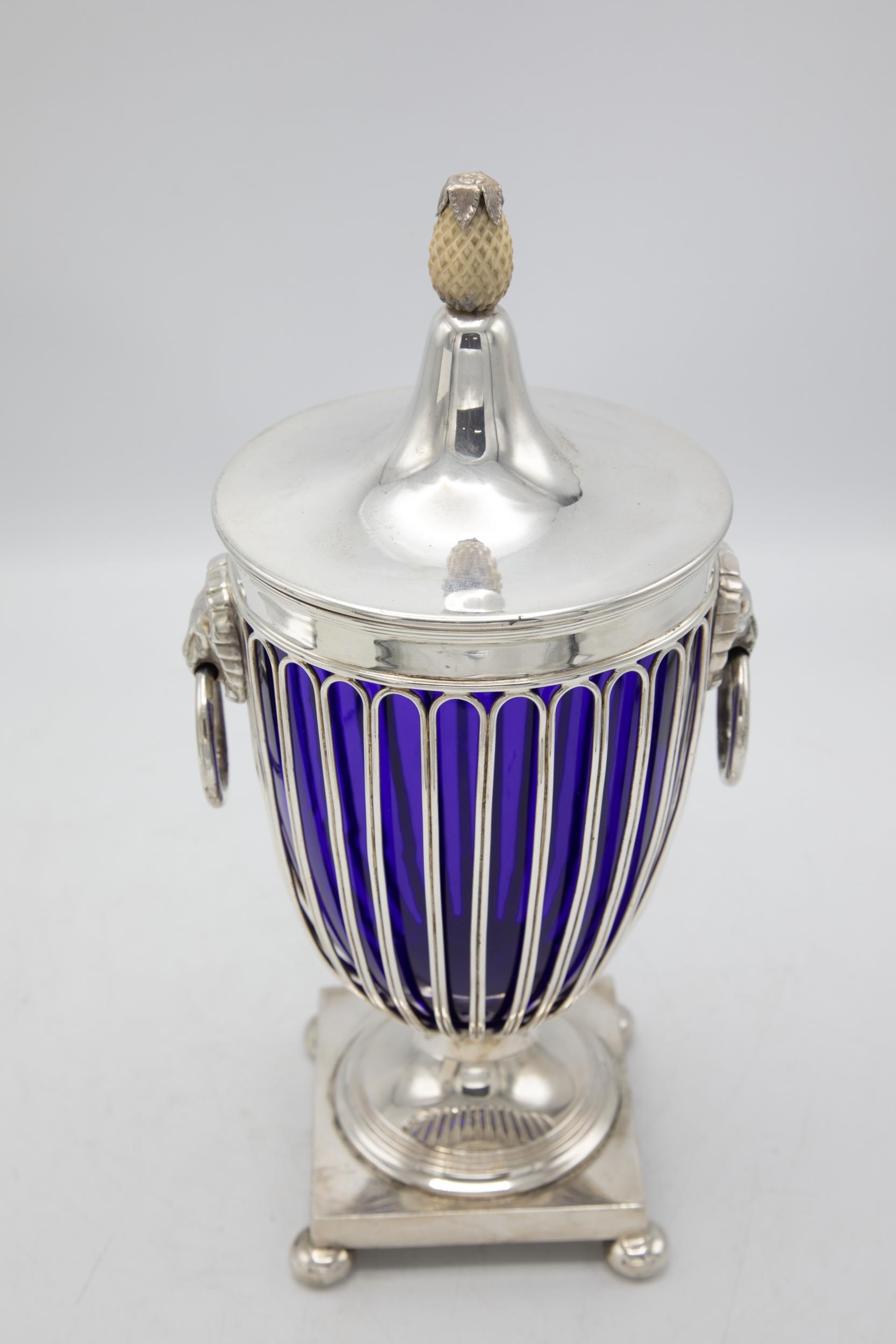 Good quality regency silver plate lidded urn, with carved pineapple finial, twin lion head hoop