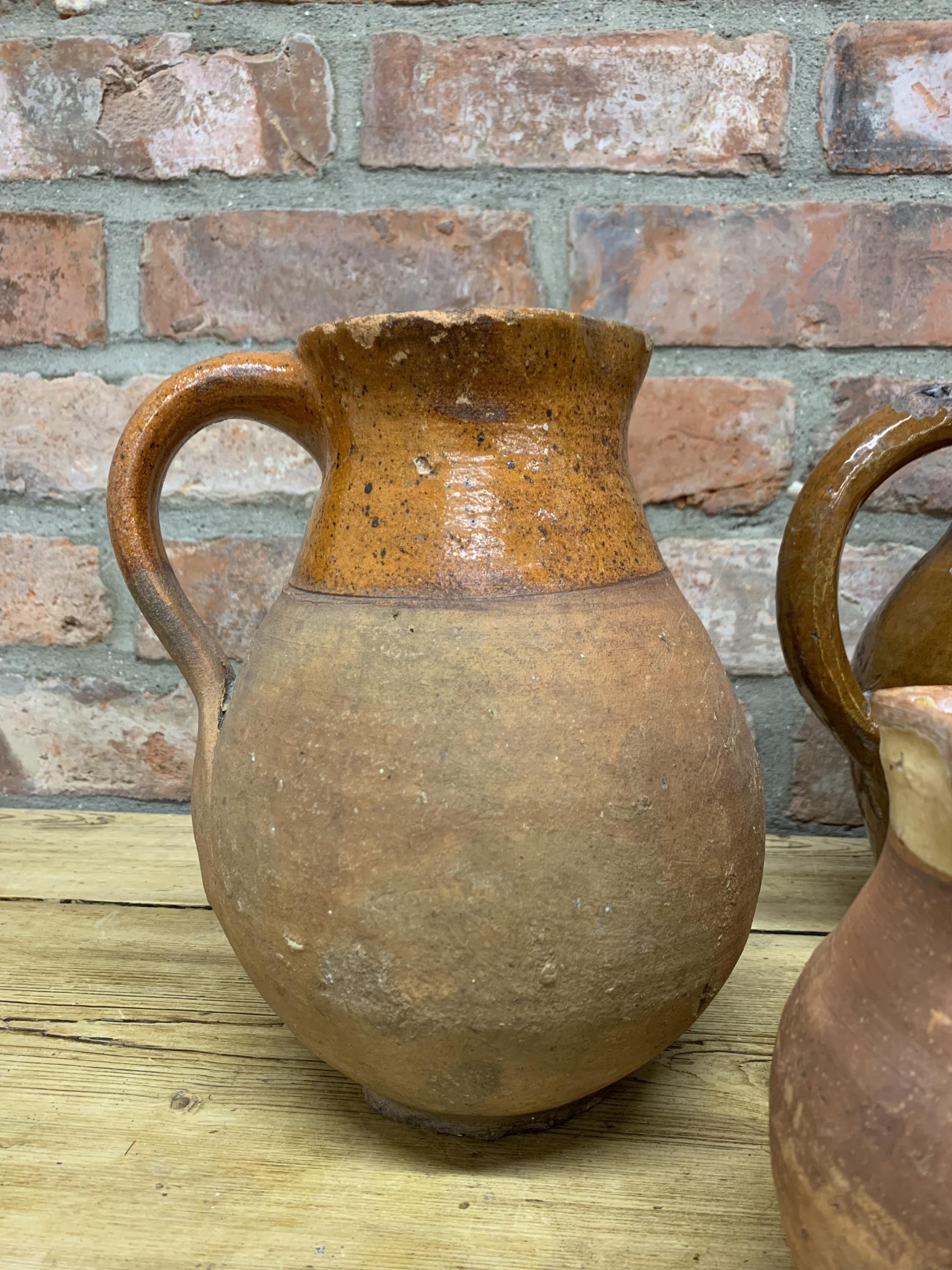 Four antique 18th Somerset glazed earthenware pitcher jugs with additional glazed puzzle jug - Image 2 of 5
