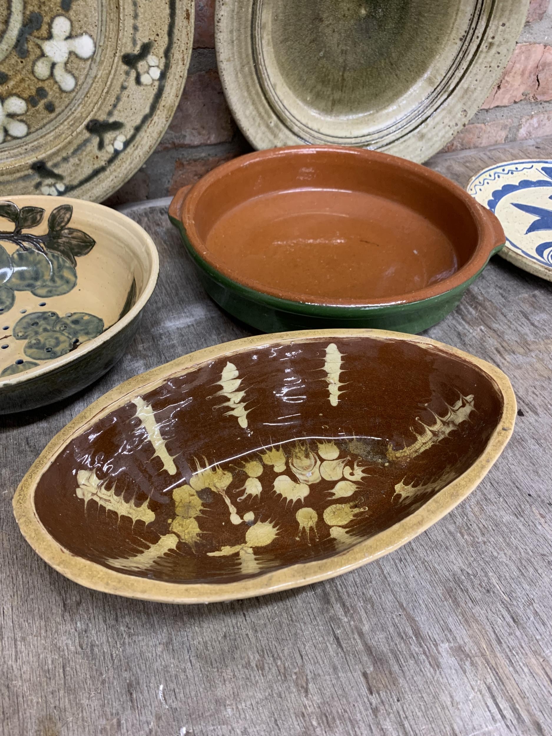 Assortment Of glazed slipware dishes to include impressive charger example, Largest D 40cm (7) - Image 4 of 5