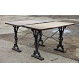 Pair of painted Victorian style cast iron tables, H 67cm x W 89cm (2)