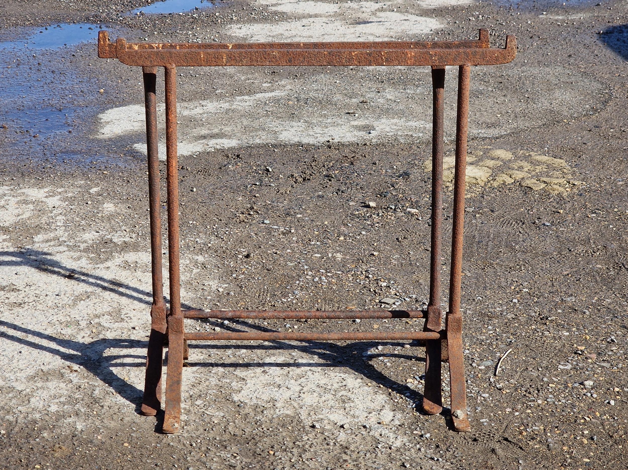 A pair of cast iron trestle table bases, H 76cm x W 78cm (2)