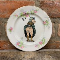 Early 20th century novelty souvenir 'saucy' ceramic plate, D 19cm