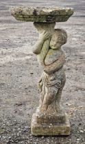 A reconstituted stone bird bath in the form of a cherub, H 80cm x 39cm diameter