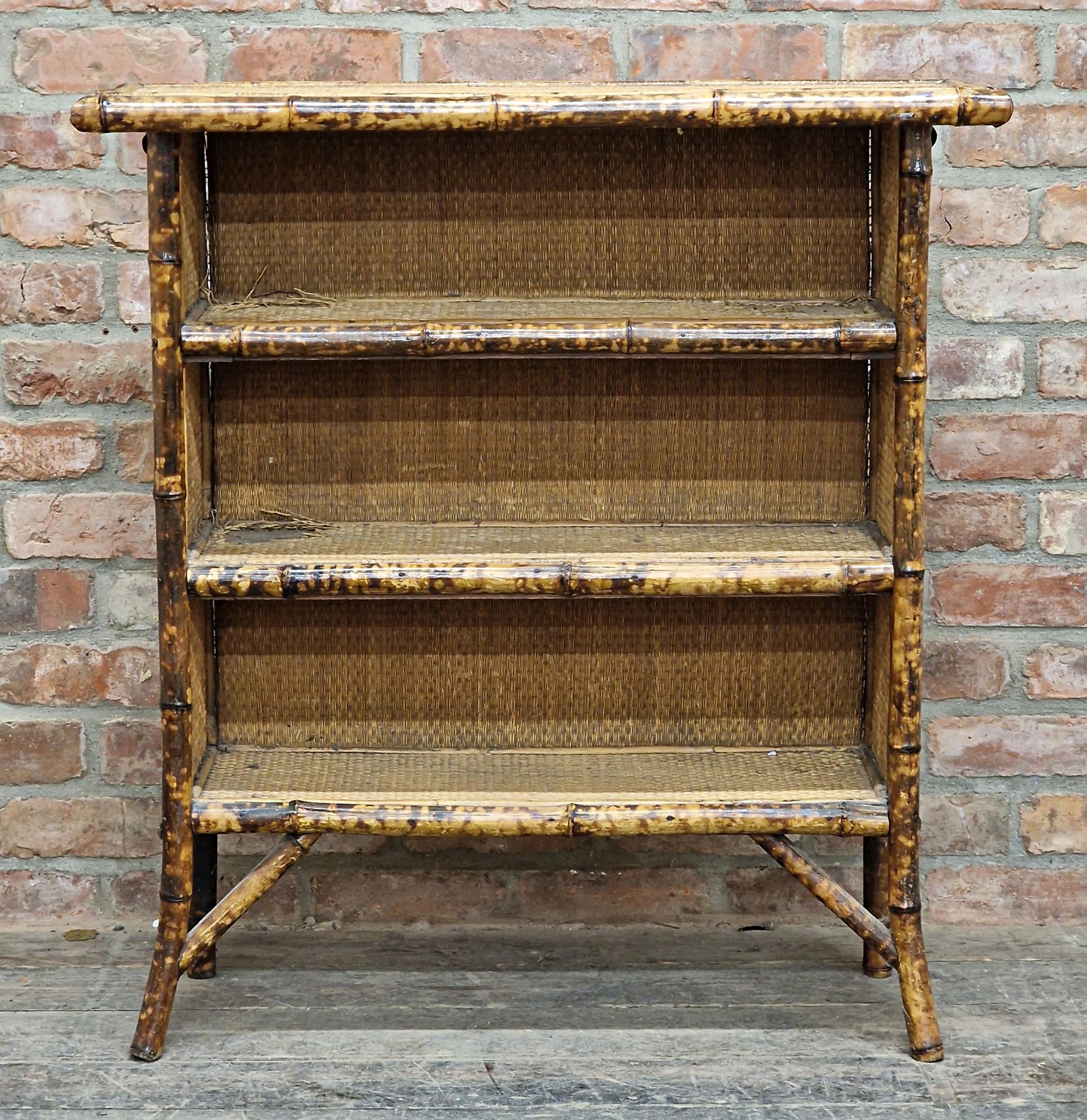 Victorian Aesthetic Movement bamboo and rattan open bookcase with three fitted shelves, H 100cm x