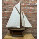 Very large hand built wooden pond yacht with original hand knotted linen sails, mounted atop
