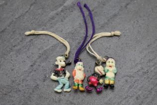 Collection of early 1920's Disney celluloid charms to include Mickey Mouse, Pop Eye, Seven Dwarfs (