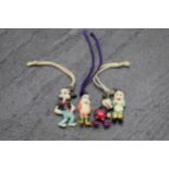 Collection of early 1920's Disney celluloid charms to include Mickey Mouse, Pop Eye, Seven Dwarfs (