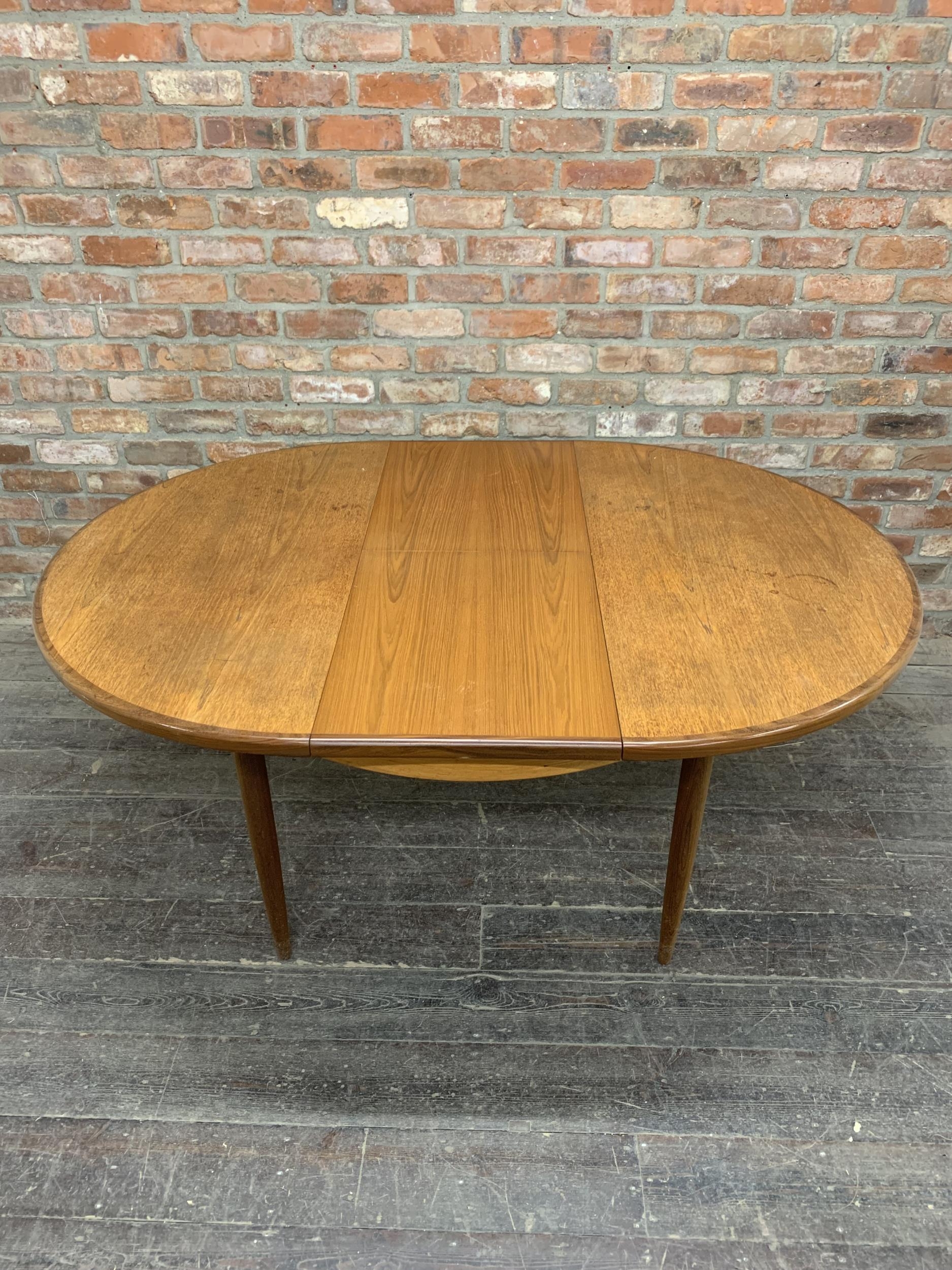 Mid 20th century G Plan teak circular extending dining table together with four chairs, H 73cm x W - Image 4 of 7