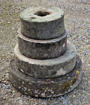 Four natural stone mill stones / grinding wheels of various sizes (4)