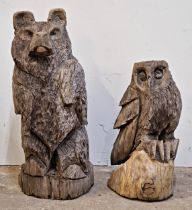 Two carved wooden sculptures of a bear and an owl, H 92cm (bear), H 63cm (owl)