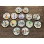 Collection of fourteen hand painted 'Japanese Beauty's' porcelain plates with original boxes and