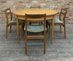Mid 20th century G Plan teak circular extending dining table together with four chairs, H 73cm x W