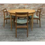 Mid 20th century G Plan teak circular extending dining table together with four chairs, H 73cm x W