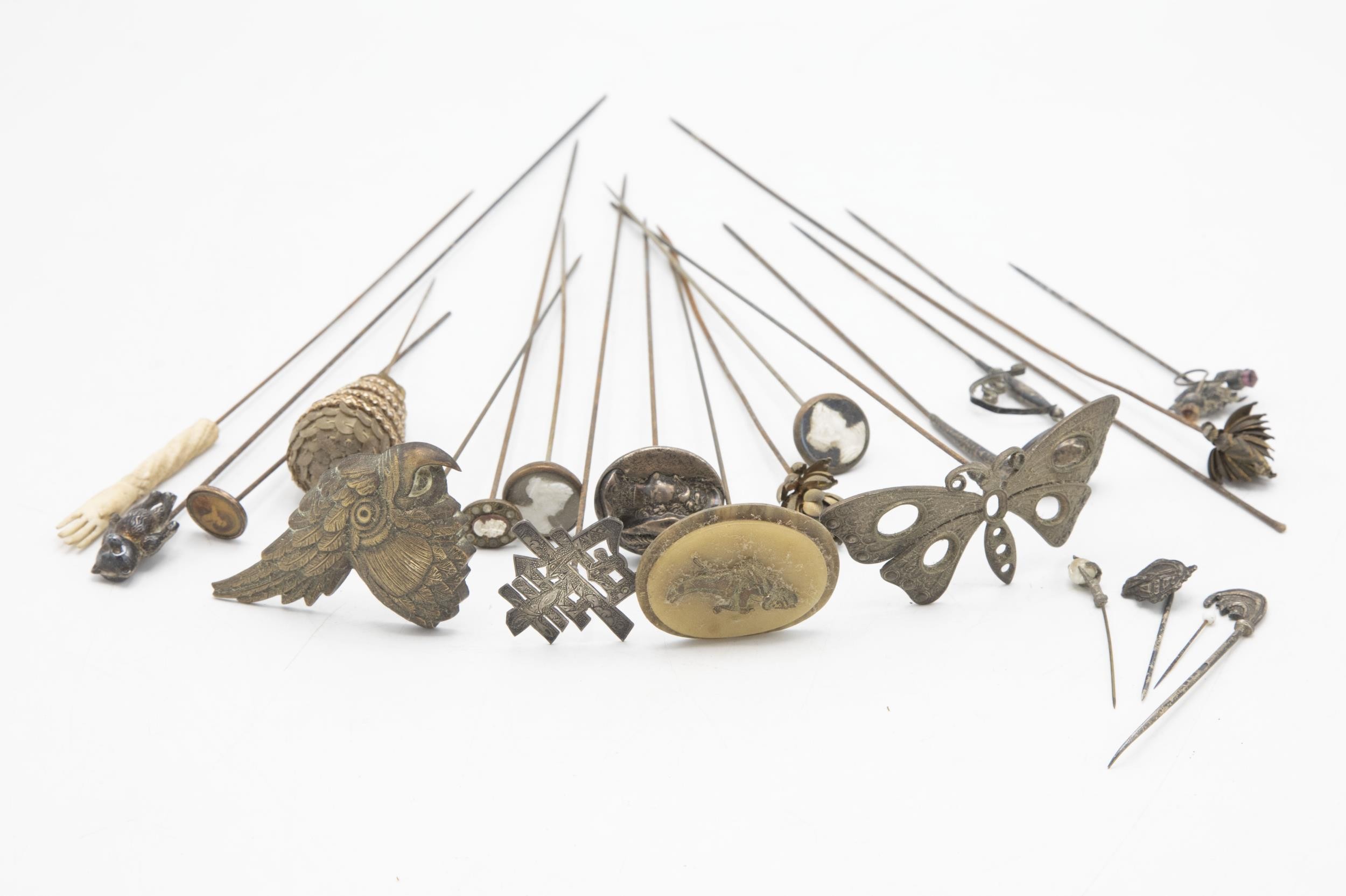 Interesting collection of hat pins of novelty form including silver hallmarked golf club, teddy