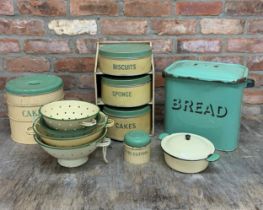 Quantity of green and cream kitchenware enamel to include bread bin, tins and sieves (10)