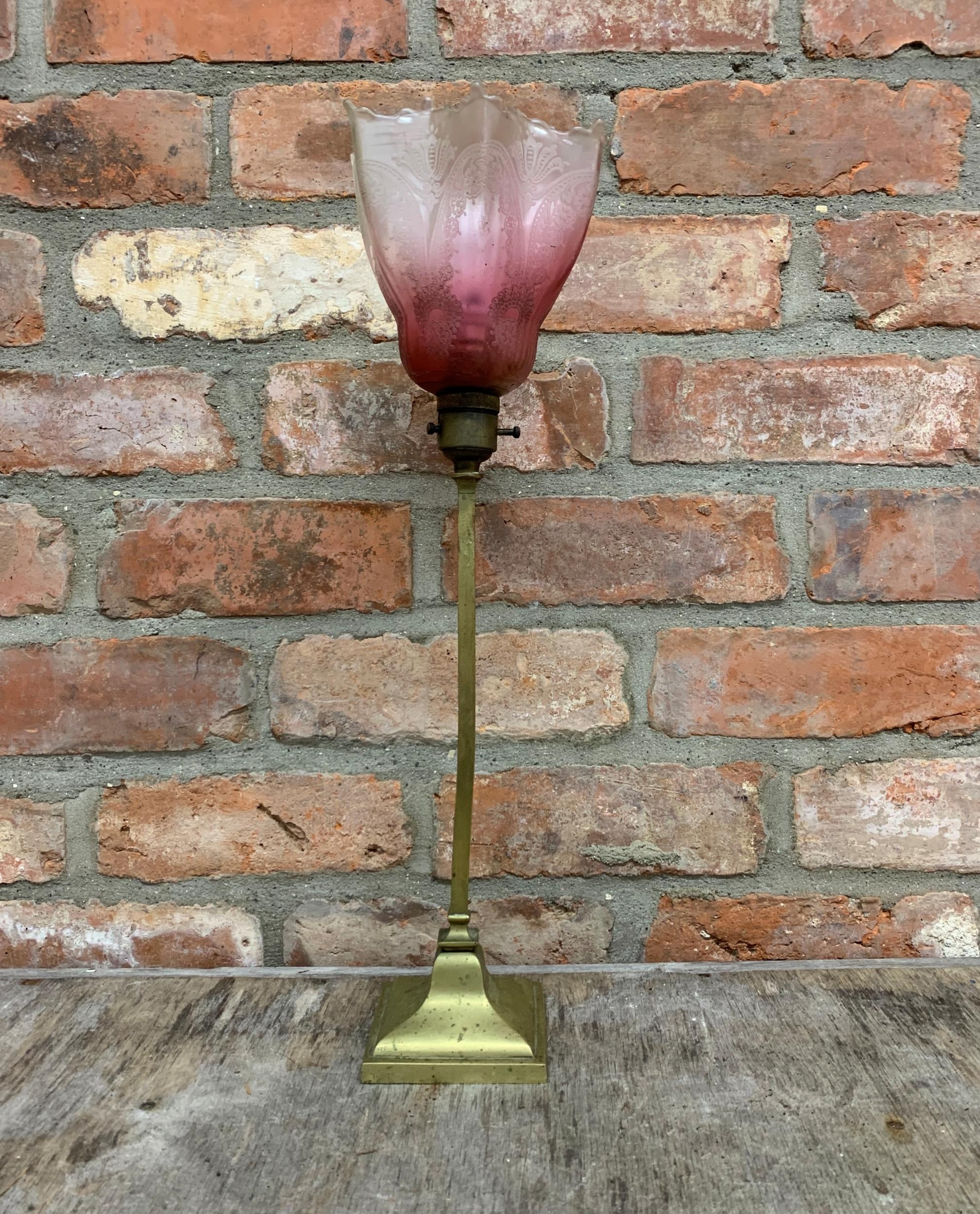 Antique Art Deco brass table lamp with fluted cranberry glass shade, H 50cm