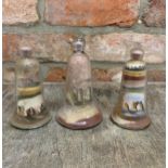 Quantity of antique glass Isle of wight sand art paper weights to include castle and coastal scene