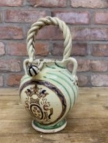 Antique 18th century Portuguese pottery water jug, cream ground and green banded finish, twist