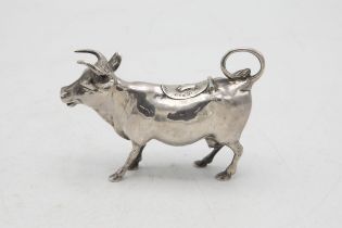 Good quality Victorian import silver novelty Cow Creamer, with hinged top mounted by a bluebell,