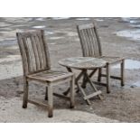 A pair of teak garden chairs with slatted seats and backs, H 63cm, together with a folding side