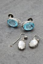 Pair of Victorian moonstone drop earrings with a further pair of Victorian blue zircon drop earrings