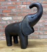Brown leather elephants foot stool, H 60cm x L 65cm