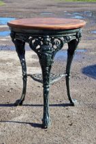 A Victorian painted cast iron Britannia pub table with pierced undershelf and circular wooden top, H