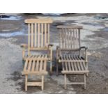 Two similar weathered teak garden loungers (2)