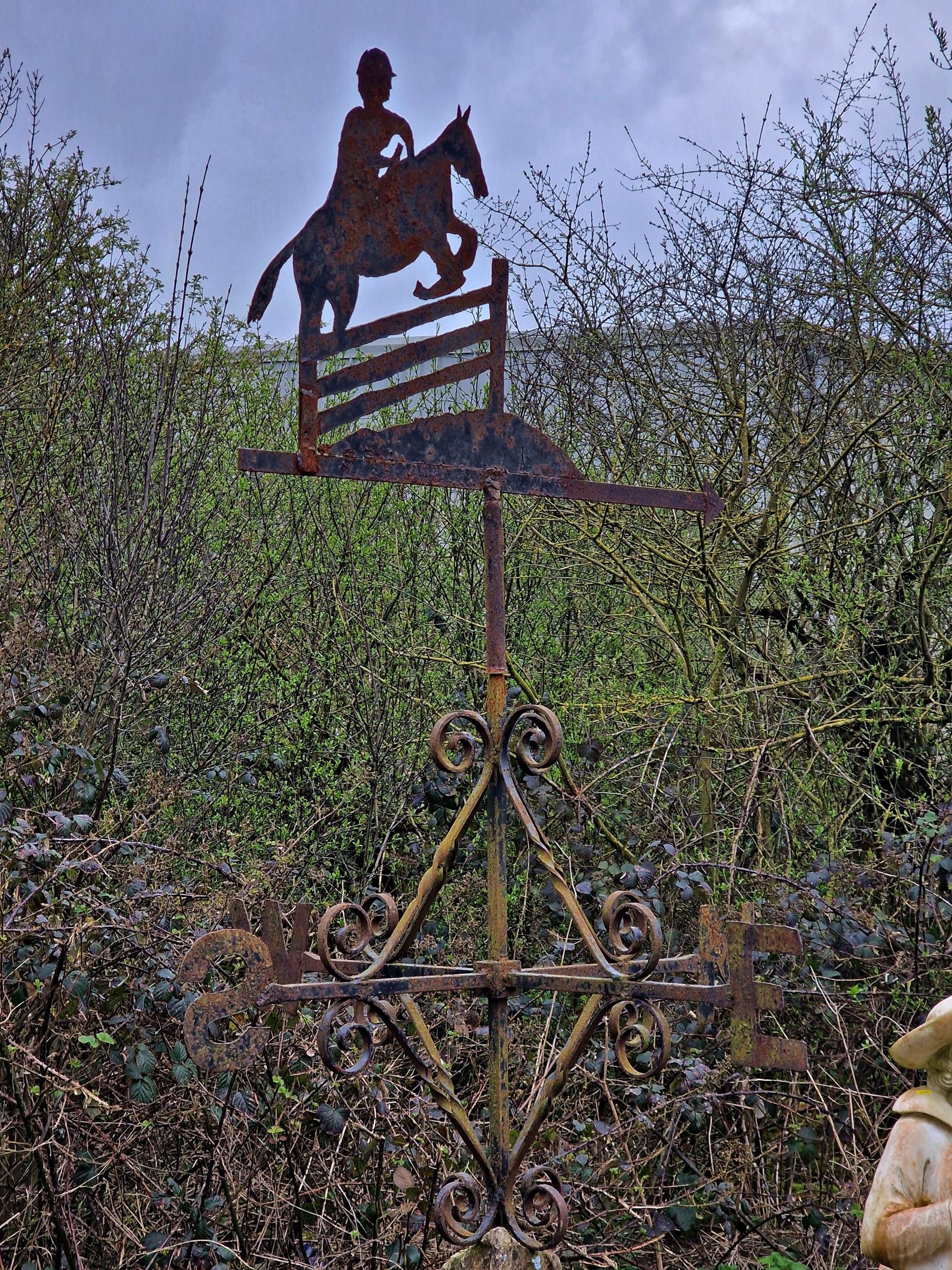 Wrought iron weathervane in the form of a show jumper with scrolled detail raised on a natural stone - Image 2 of 2