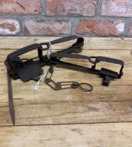 Two antique hand forged wrought iron gin traps (2)