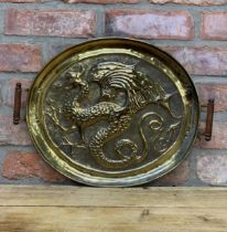 Arts & Crafts twin handled hammered brass serving tray with central dragon design, 46cm x 34cm