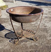A cast iron firepit with bowl raised on scrolled supports, H 49cm x W 57cm