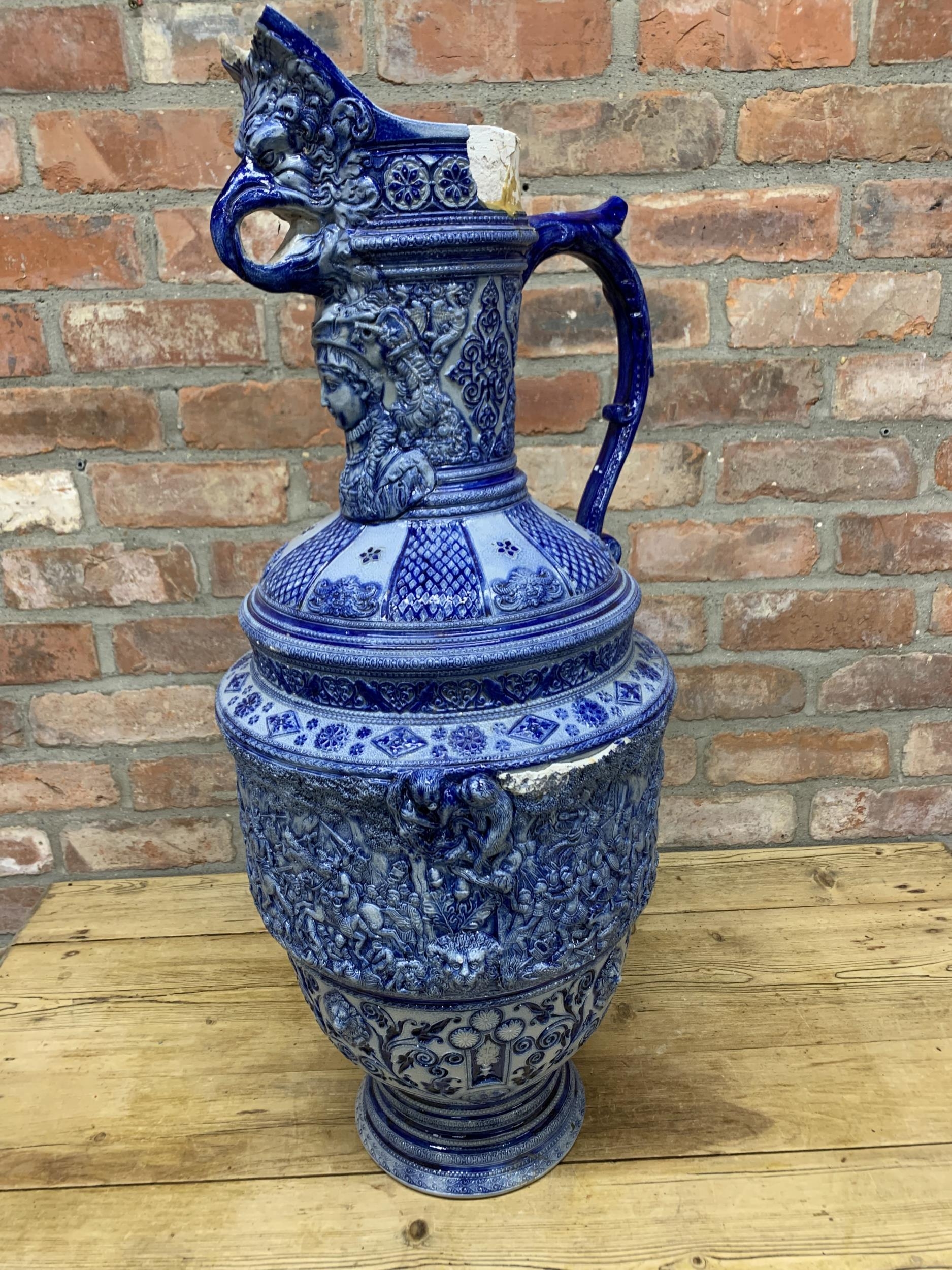 Very large Westerwald Rhineware exhibition blue and white ewer with ornate battlefield scene, H 86cm - Image 4 of 4