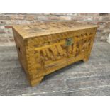 Chinese carved camphorwood chest depicting a sailing scene, H 58cm x W 101cm x D 50cm