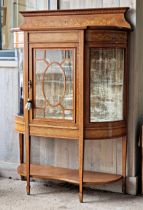 An Edwardian mahogany and satinwood inlaid bow front display cabinet with raised gallery back on