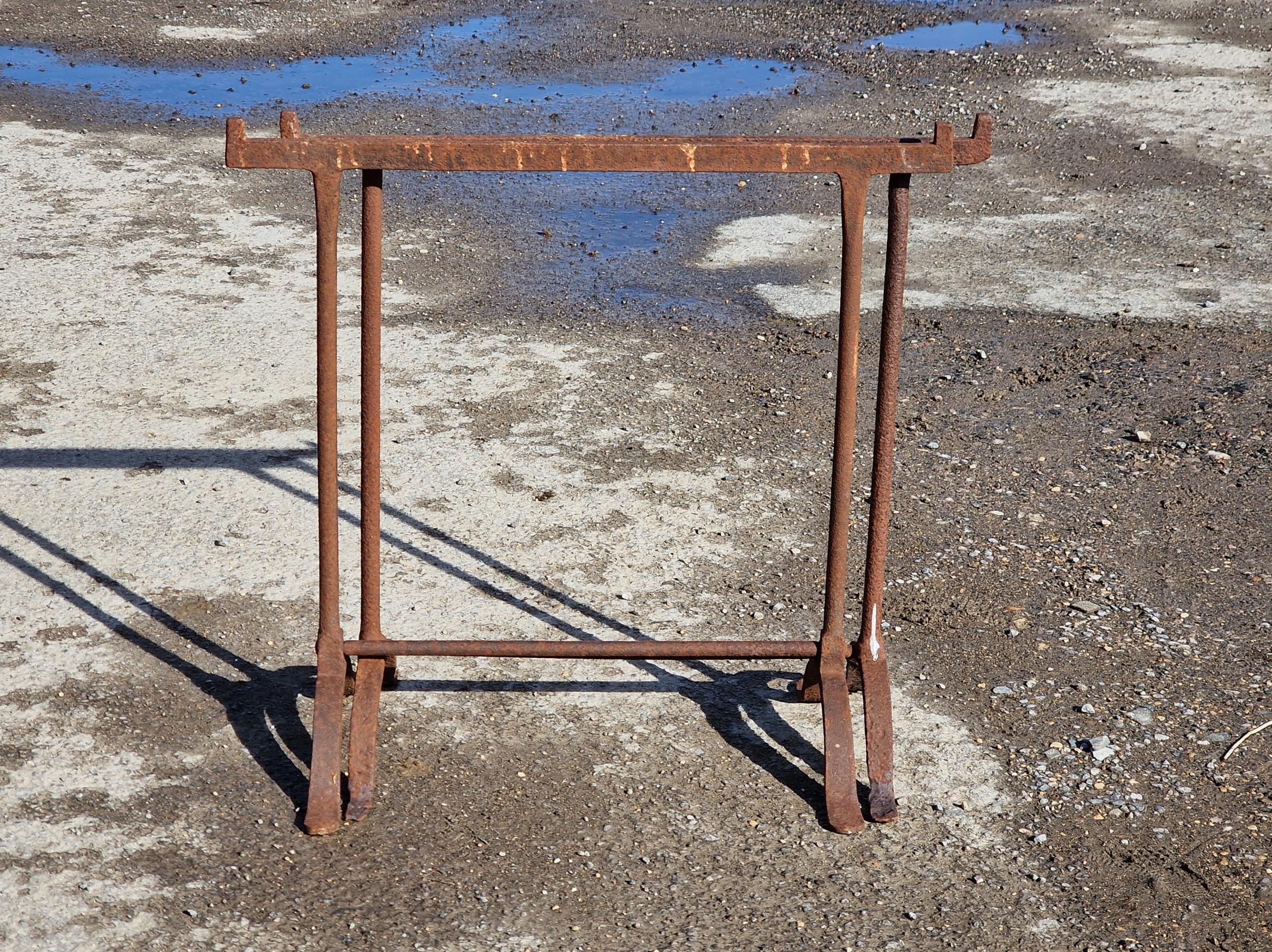 A pair of cast iron trestle table bases, H 76cm x W 78cm (2)