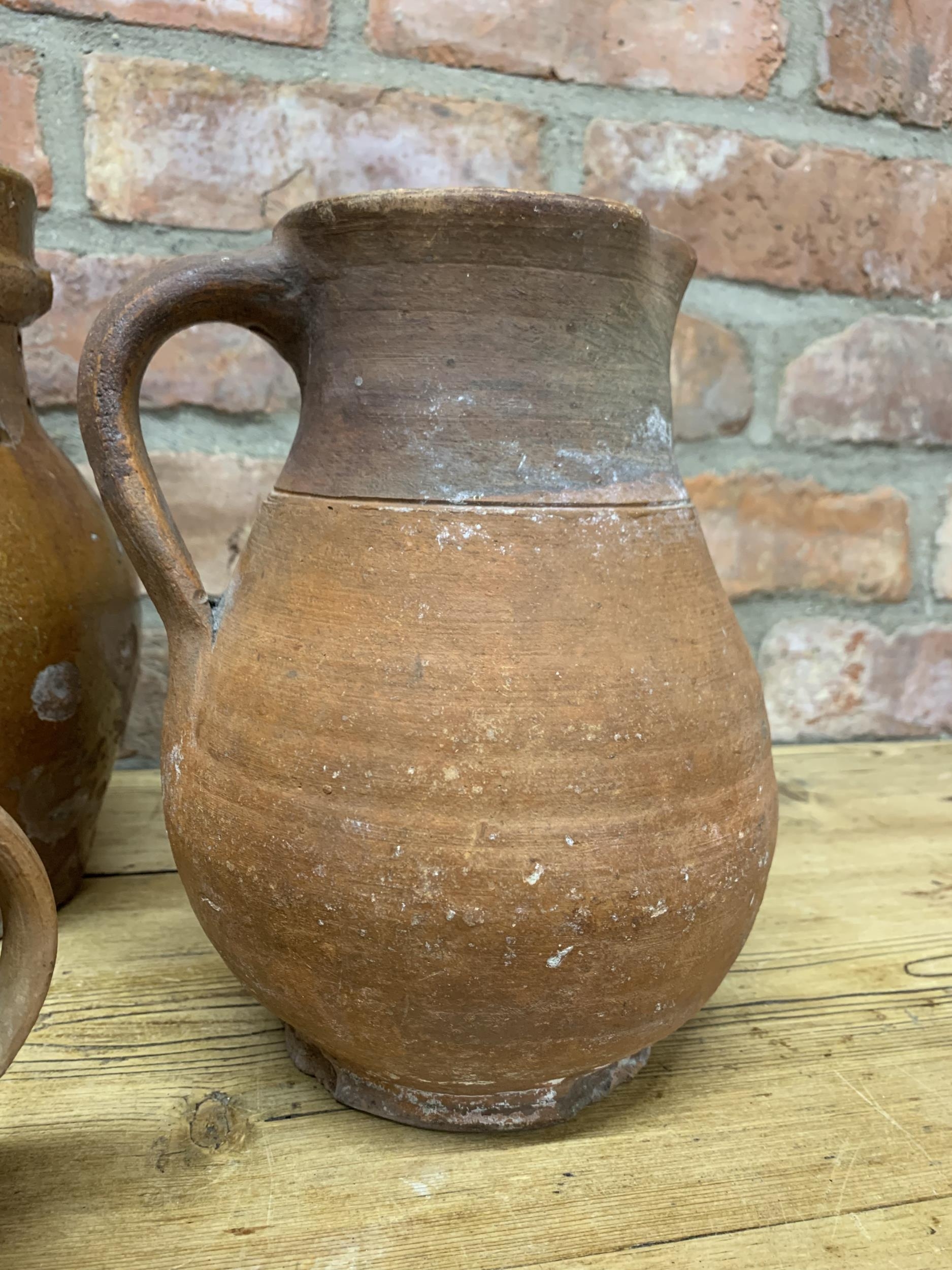 Four antique 18th Somerset glazed earthenware pitcher jugs with additional glazed puzzle jug - Image 5 of 5