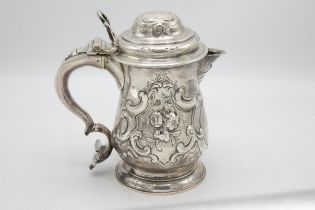 Georgian silver lidded beer tankard jug, with later floral chasing and crest inscribed 'Prize 1857',