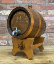 Hand painted wooden sherry barrel for 'Howells Bristol Milk Sherry', banded copper finish with