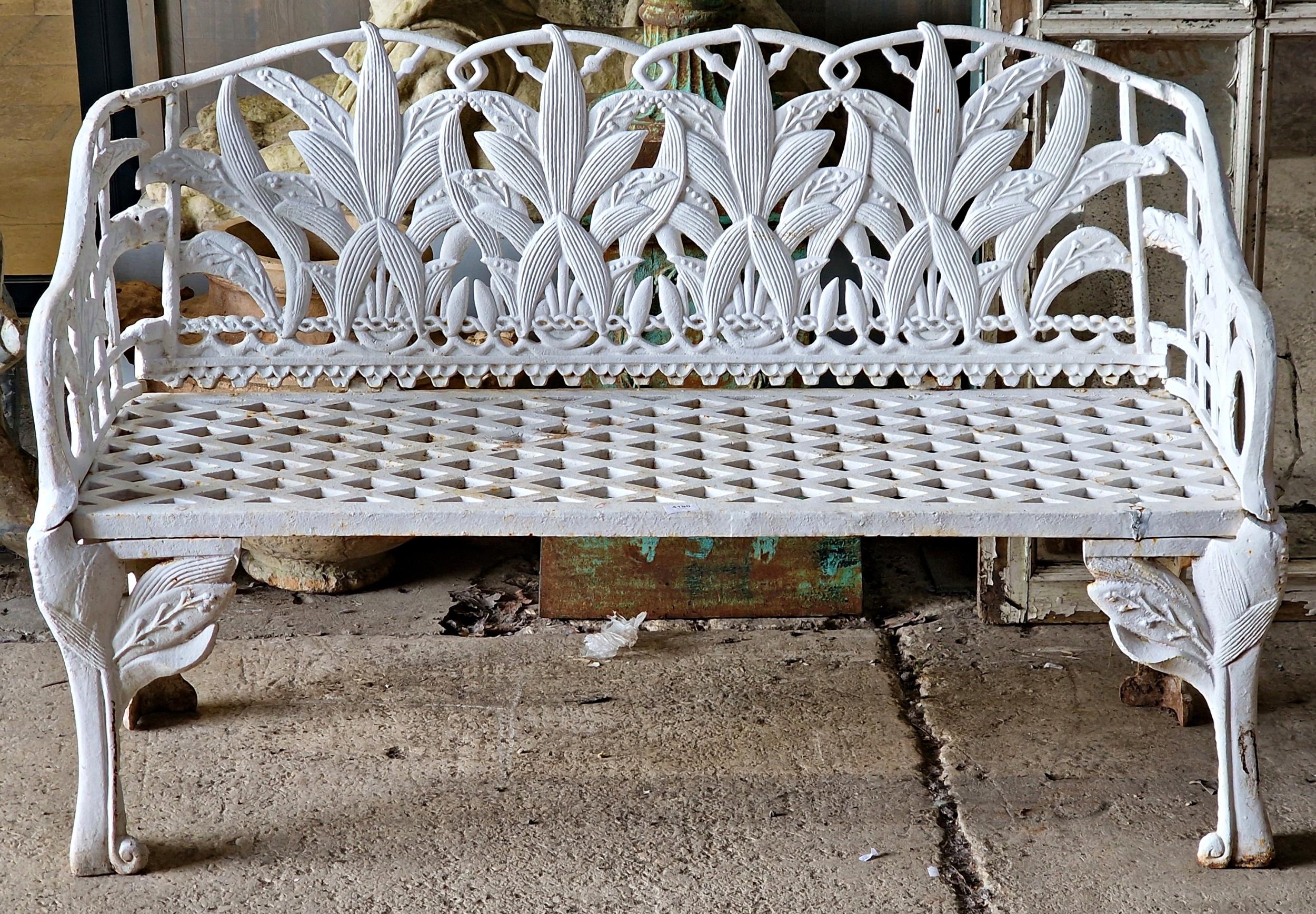 A good quality 20th century painted cast iron Coalbrookdale style bench with pierced floral design