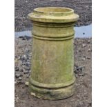 A weathered buff coloured chimney pot, H 54cm