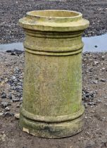 A weathered buff coloured chimney pot, H 54cm