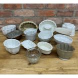 Assortment of antique jelly moulds to include ceramic, stoneware and glass examples (12)