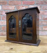 Edwardian oak wood smokers cabinet with bevelled glass doors, H 30cm x W34cm