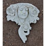 Contemporary reconstituted stone garden wall planter of a girls face with floral detail, H 34cm x